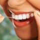 Чистка зубов нитью может нанести вред организму